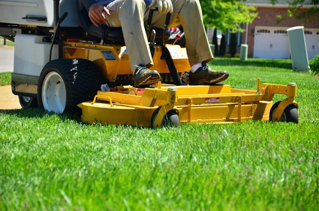 Man mowing lawn with zero turn